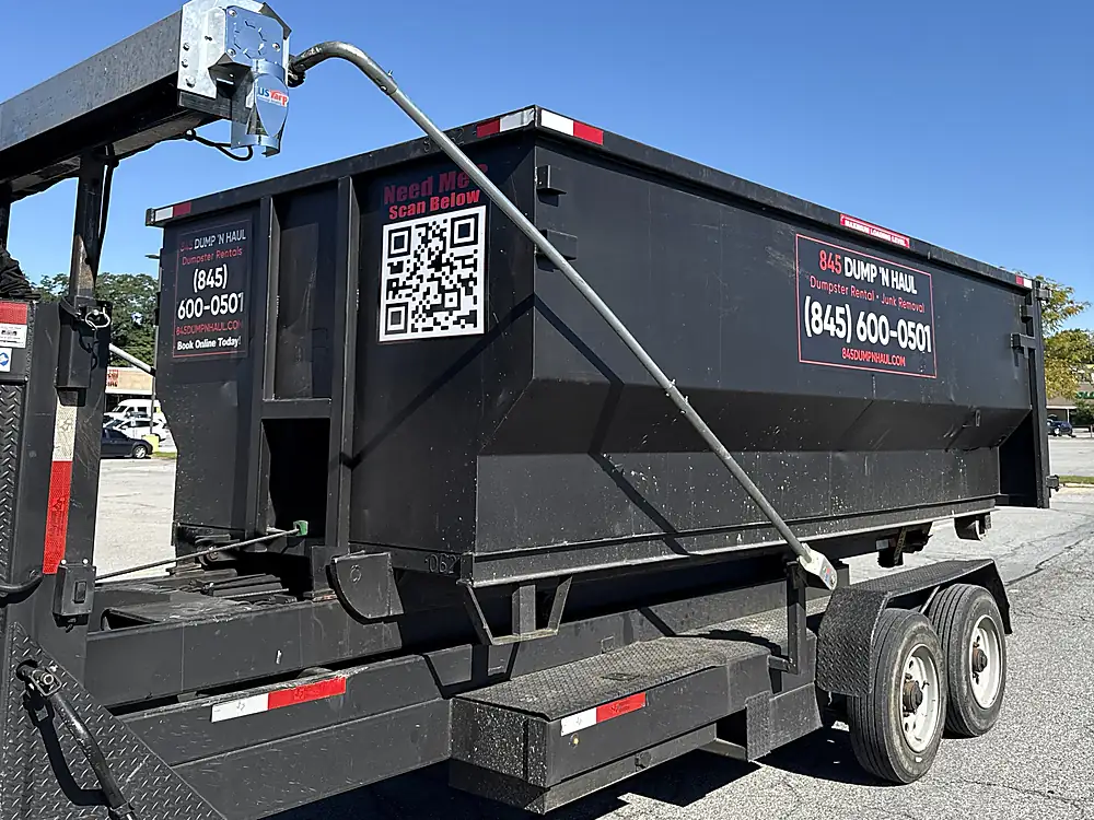 Roll-off container tarped and secured for transport in Poughkeepsie, NY — 845 Dump 'N Haul
