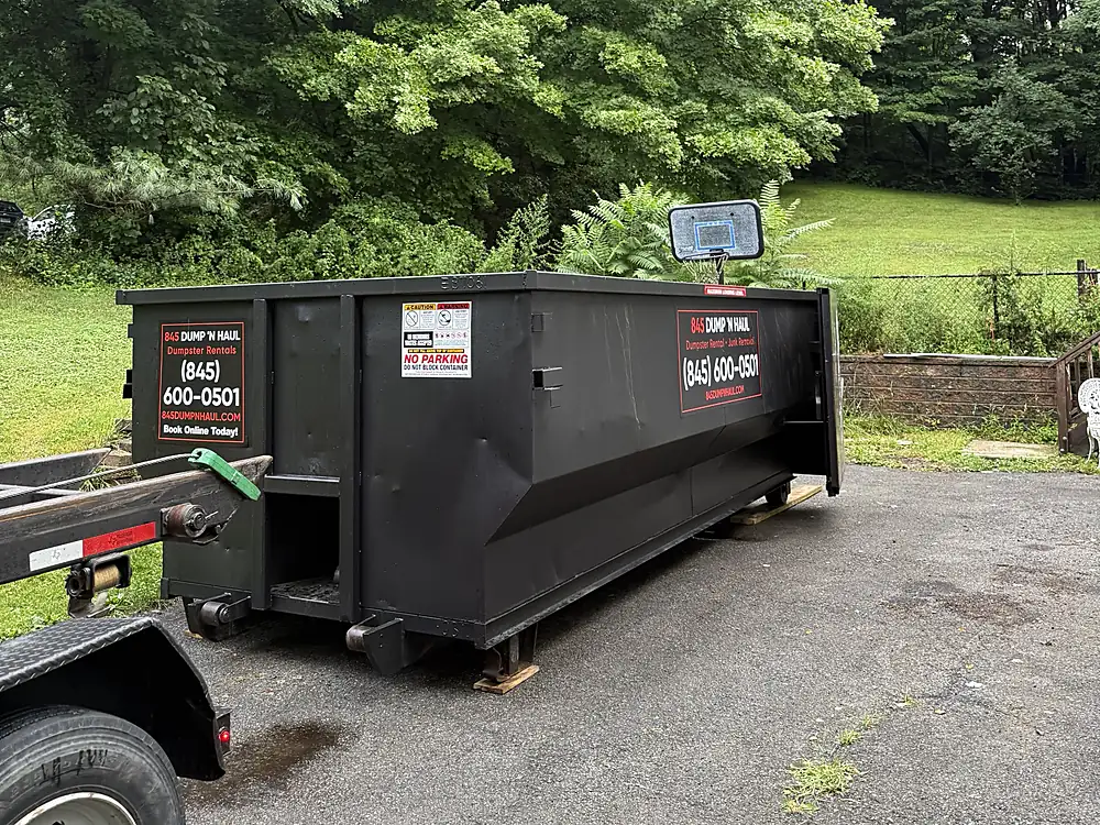 Roll-off dumpster delivered to a wooded Hudson Valley property in Beacon, NY — 845 Dump 'N Haul