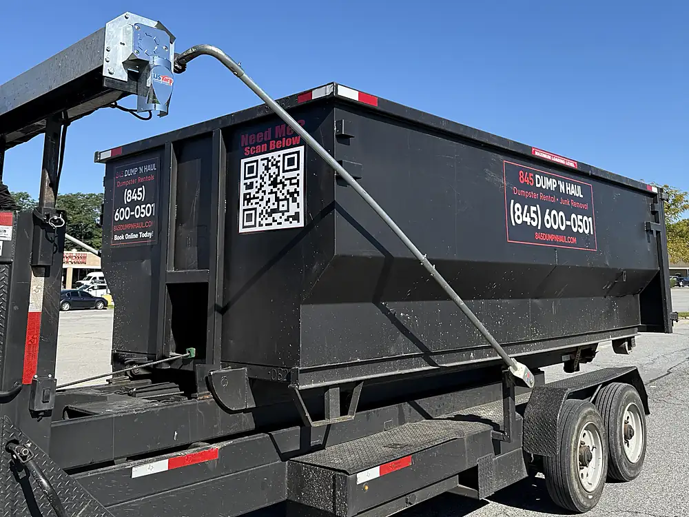 Side view of a 845 Dump \u2019N Haul roll-off container — 845 Dump 'N Haul, Dutchess County NY