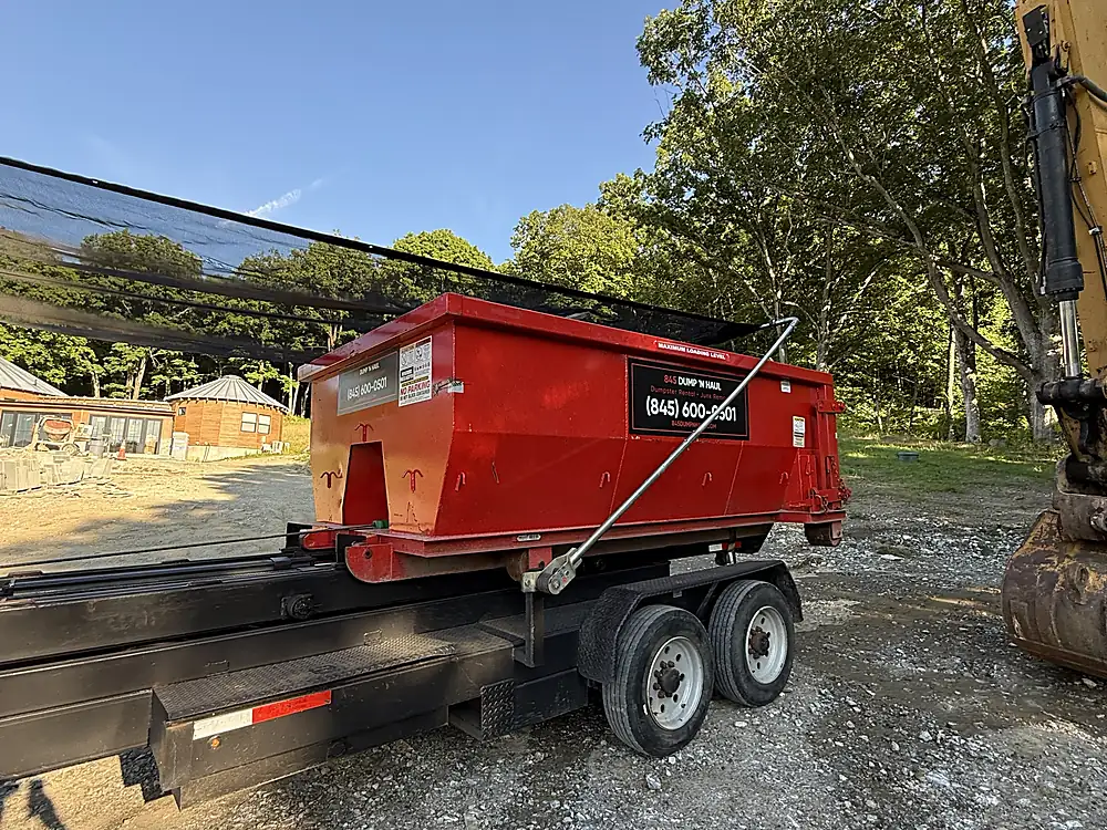 Roll-off container on a construction site next to an excavator — 845 Dump 'N Haul, Dutchess County NY