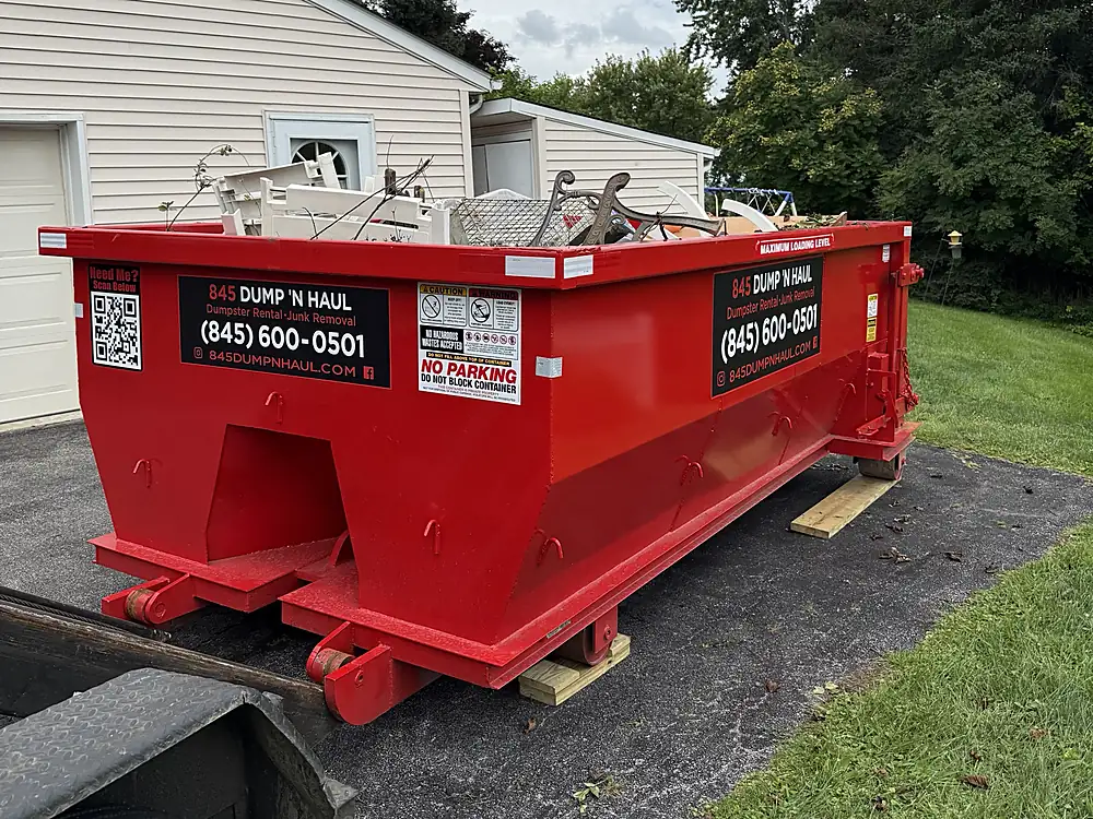 Dumpster loaded with old furniture during a home cleanout — 845 Dump 'N Haul, Dutchess County NY