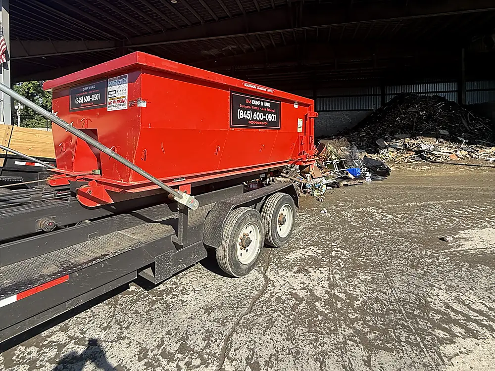 Dumpster being emptied at a licensed transfer station — 845 Dump 'N Haul, Dutchess County NY